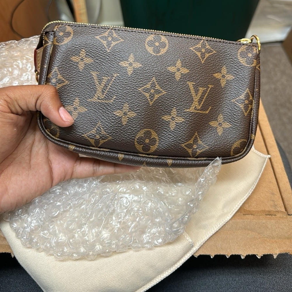 Monogram bucket pouch